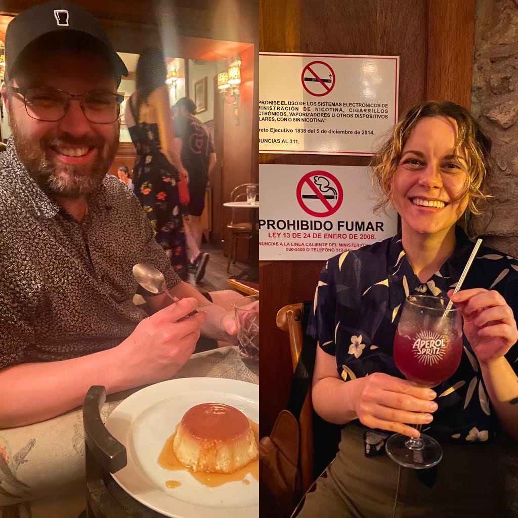 Dustin smiling with a plate of flan and Leah smiling with no smoking signs behind her. 
