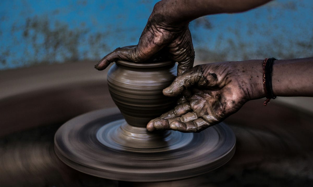 Potter making a pot.