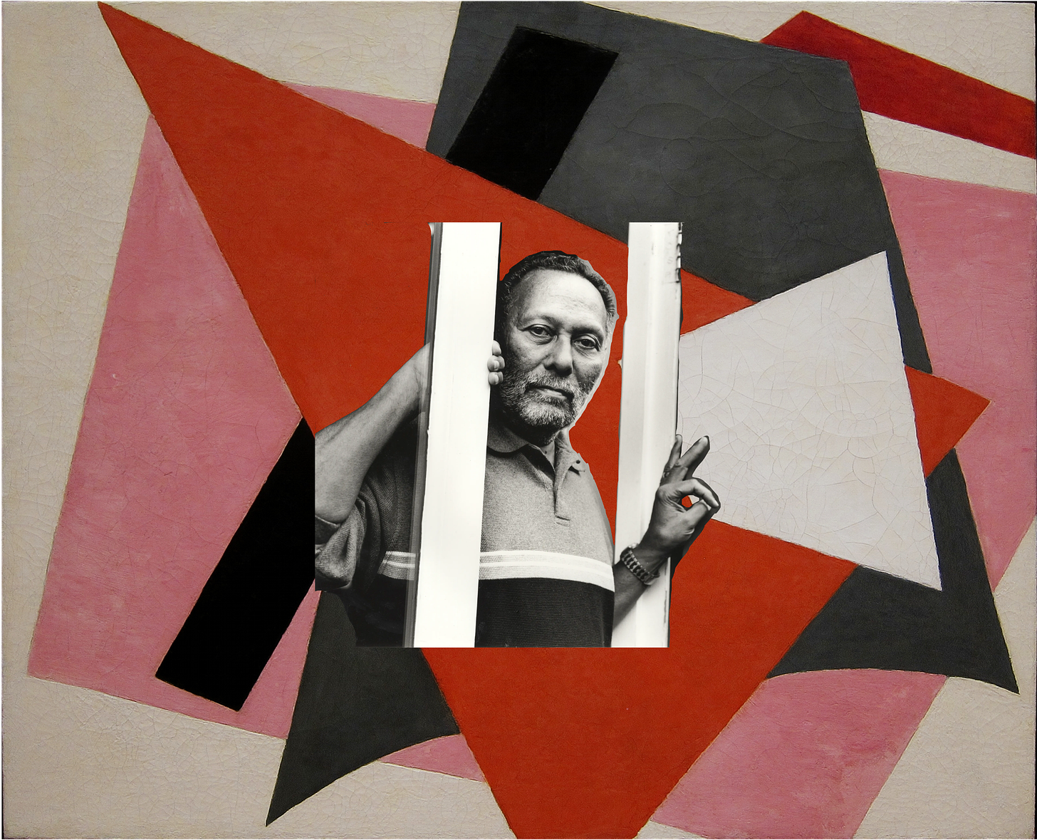 A cut out of a photographed Stuart Hall leaning between two door posts. This cut out is over a painting consisting of 6 overlapping geometric shapes from forward to back: a white cracked four sided polygon, a red triangle, a black unequal rectangle, a charcoal quadrilateral with the lower edge curved, a pink quadrilateral, and finally a thin red shape in the top right underneath the charcoal quadrilateral.