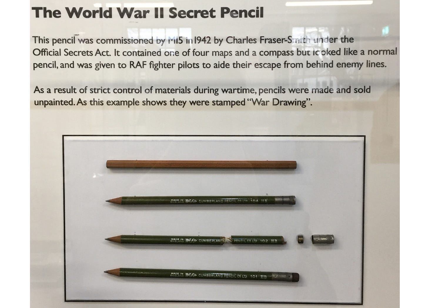 A photograph of a display case at Derwent Pencil Museum, Keswick, UK. The display shows real examples of the secret pencil and briefly explains it's history