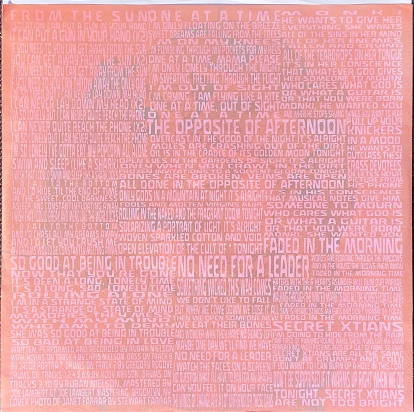 a scan of the record sleeve for Unknown Mortal Orchestra's II, which is densely packed with the liner notes/lyrics for the album