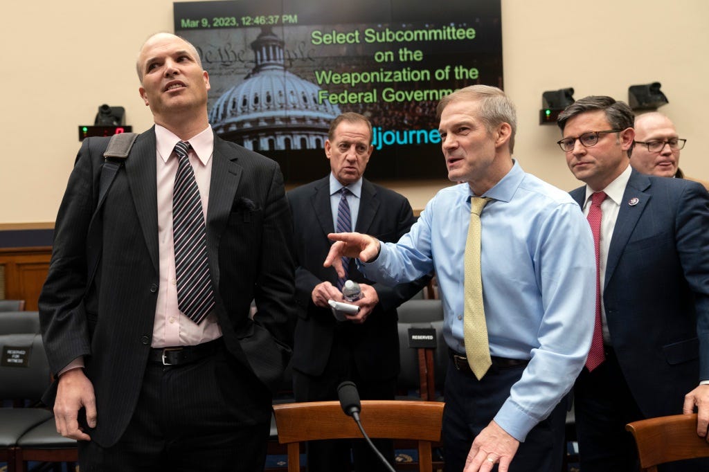 Chairman Jim Jordan, R-Ohio, and Rep. Mike Johnson, R-La., right, join witness Matt Taibbi, left, at the conclusion of a House Judiciary subcommittee hearing on what Republicans say is the politicization of the FBI and Justice Department and attacks on American civil liberties.