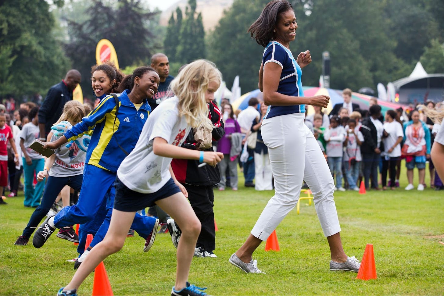 Former First Lady Michelle Obama participates in an activity during a “Let’s Move!” event in 2012 in London. 