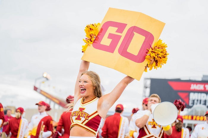 Cheerleader says “go”