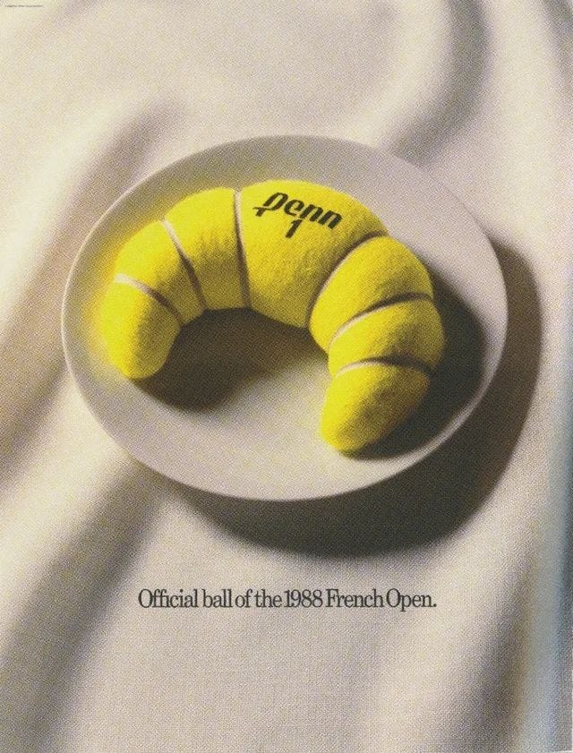 Ad that's of a tennis ball that looks like a croissant