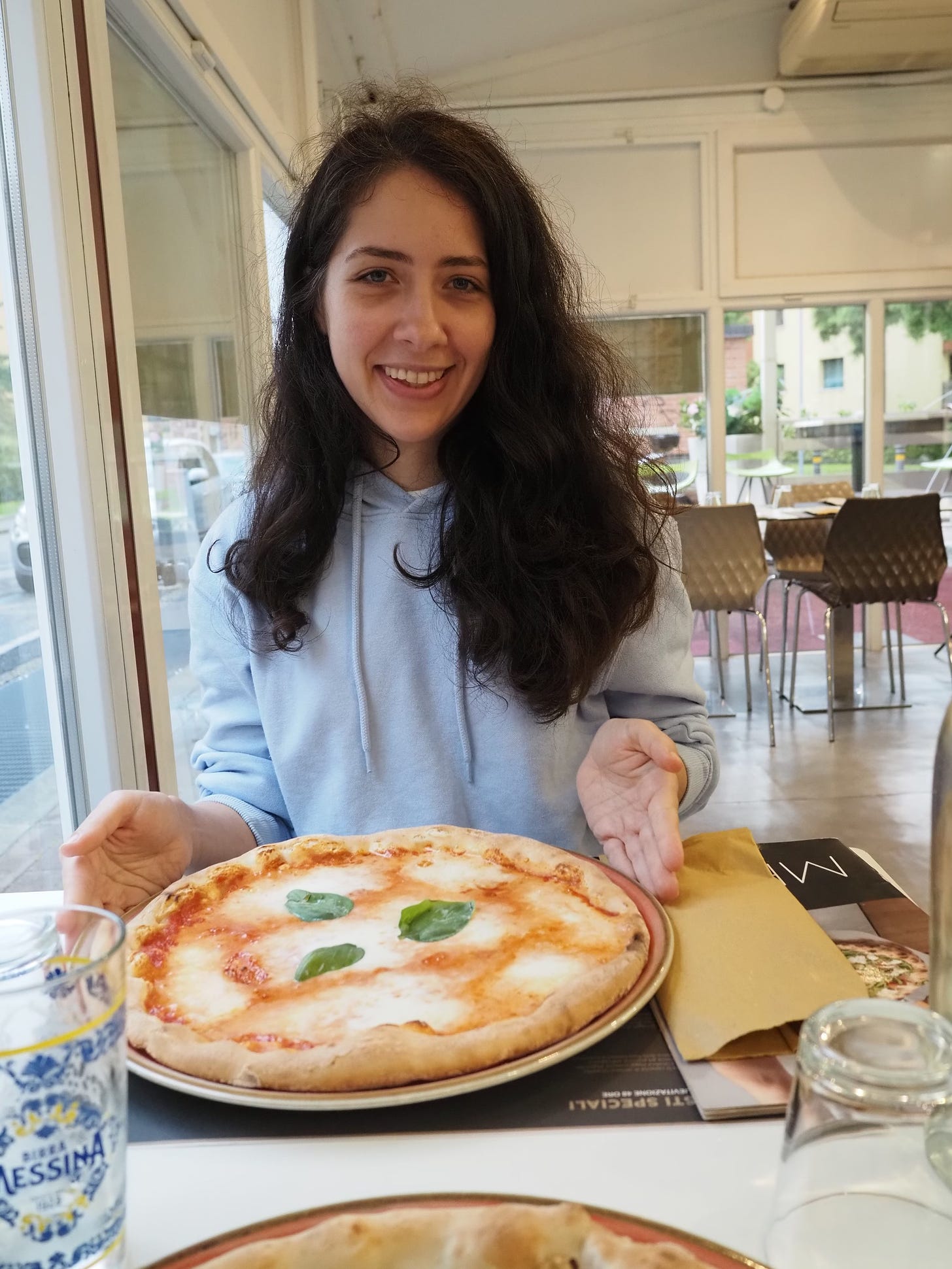 christina heiser in bologna with pizza