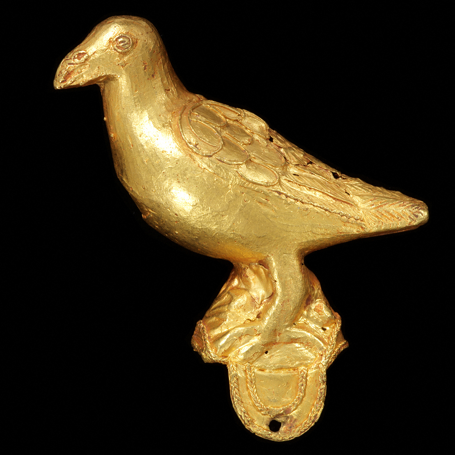 A cast gold ornament, in the form of a bird, is displayed in this undated handout picture