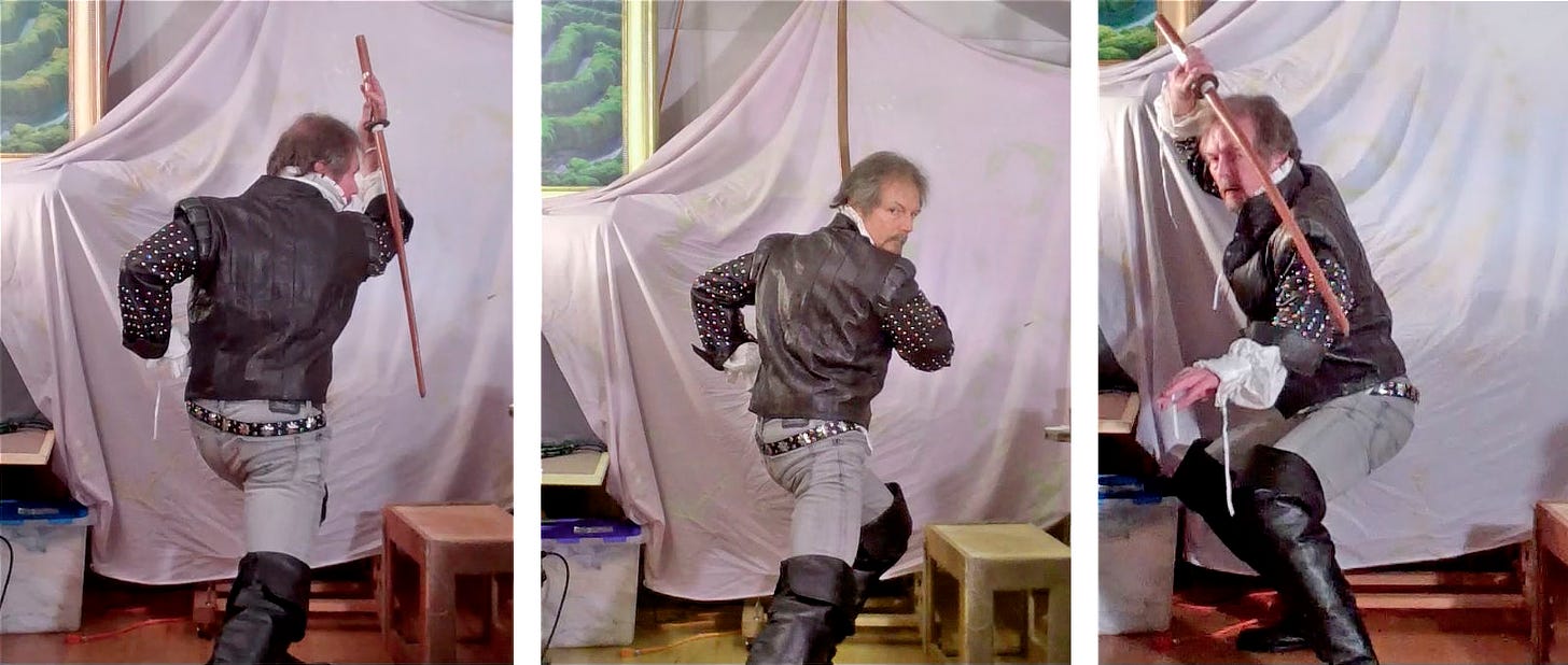 A sequence of three photos with Michael posing with a wooden katana. He's dressed in leather coat with studs along the arms. His boots are thigh high.