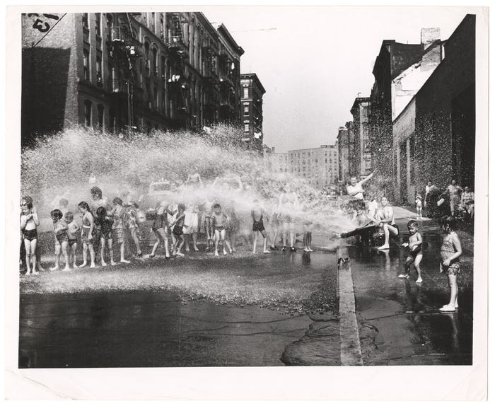 Children playing in water sprayed from open fire hydrant, Lower East Side, New  York] | International Center of Photography