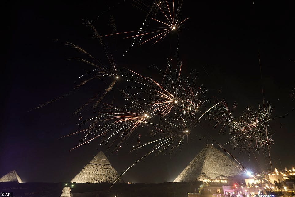EGYPT: Fireworks spark over the historical site of Giza Pyramids just outside Cairo
