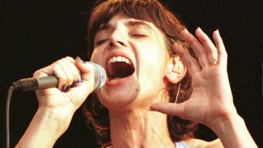 Woman holds microphone 