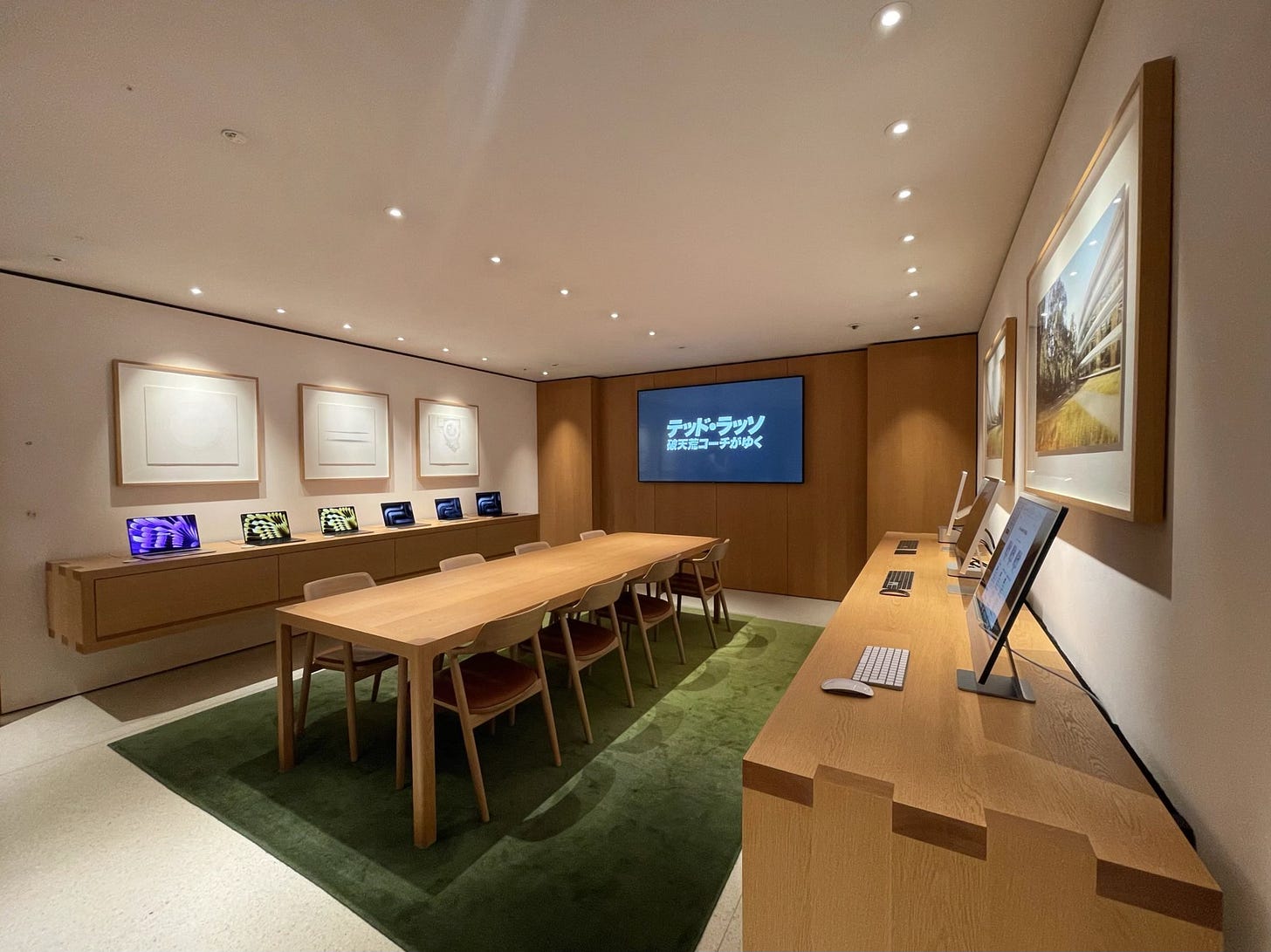 The Boardroom at Apple Shibuya. The credenzas along the walls are filled with desktop and laptop Macs.