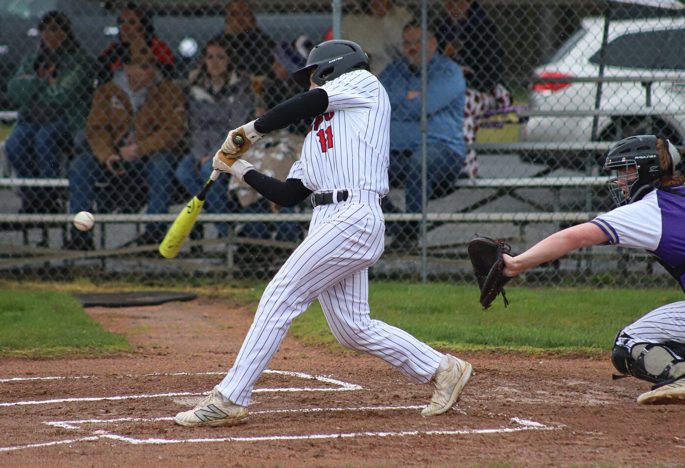 Toledo's Rohan Feigenbaum (11) swings at a pitch against Onalaska at Toledo High School on Friday, March 14. Toledo's Rohan Feigenbaum (11) swings at a pitch against Onalaska at Toledo High School on Friday, March 14.