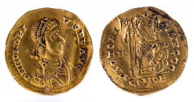 Ancient Roman gold solidus coin of Emperor Honorius.