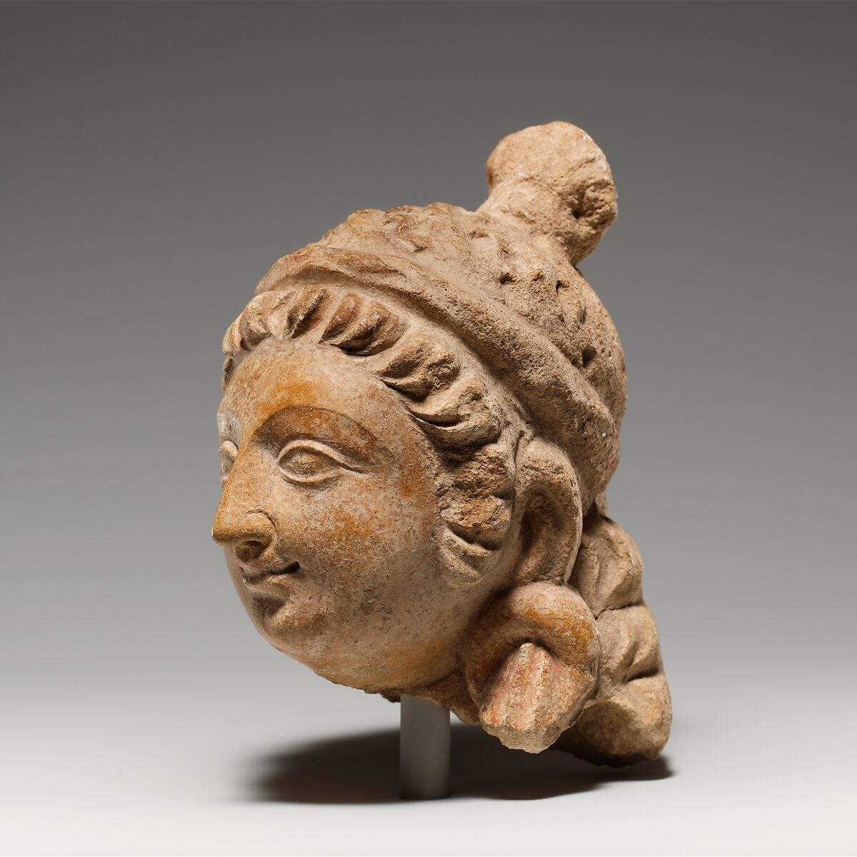 Head of a Female Figure, Stucco with traces of color, Pakistan (ancient region of Gandhara) 