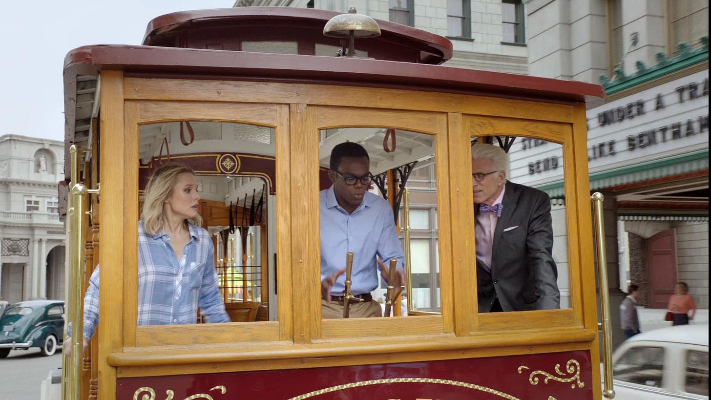 Elanor, Chidi and Michael on a trolley