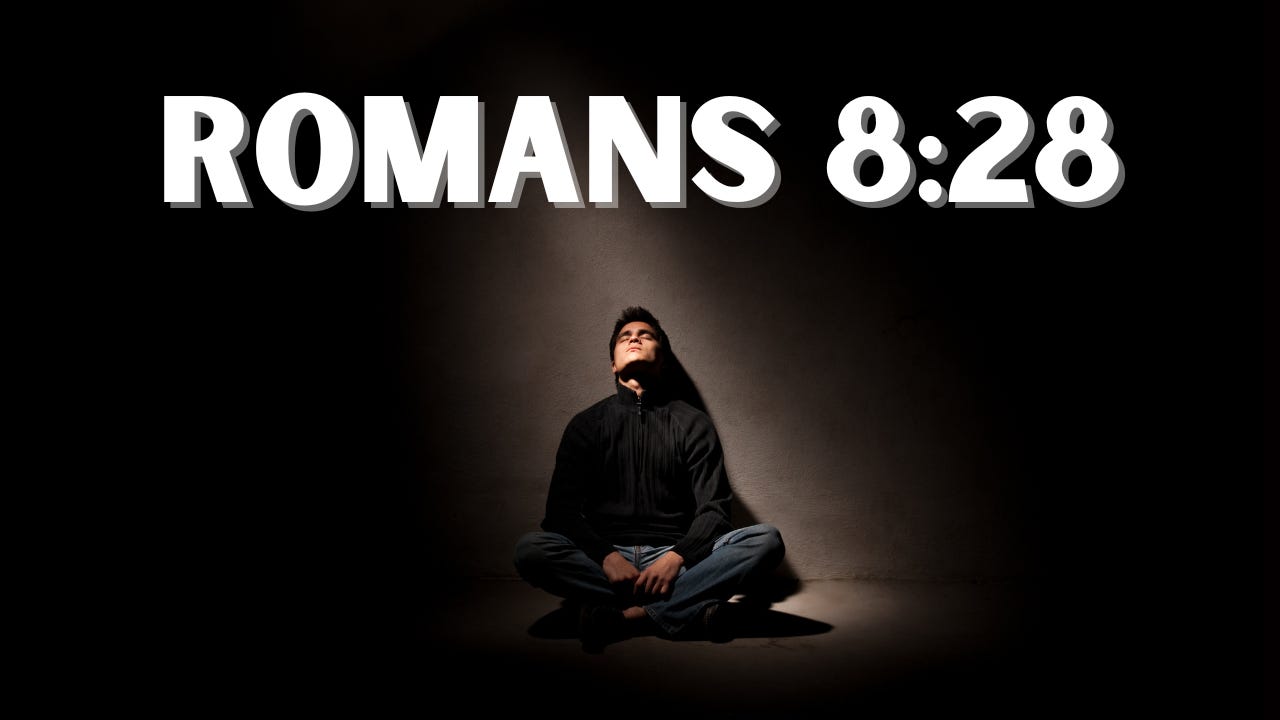 A man sitting alone under the words, "Romans 8:28."