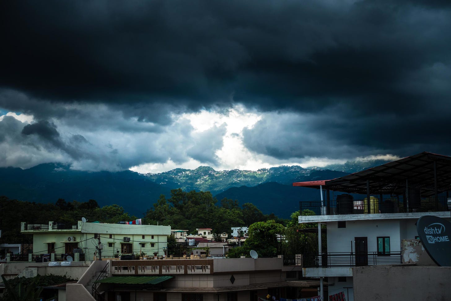 31st july 2021. Dehradun, Uttarakhand, India. A wide angle view of mussoorie  hills from dehradun city with dark clouds and sun. 8134898 Stock Photo at  Vecteezy