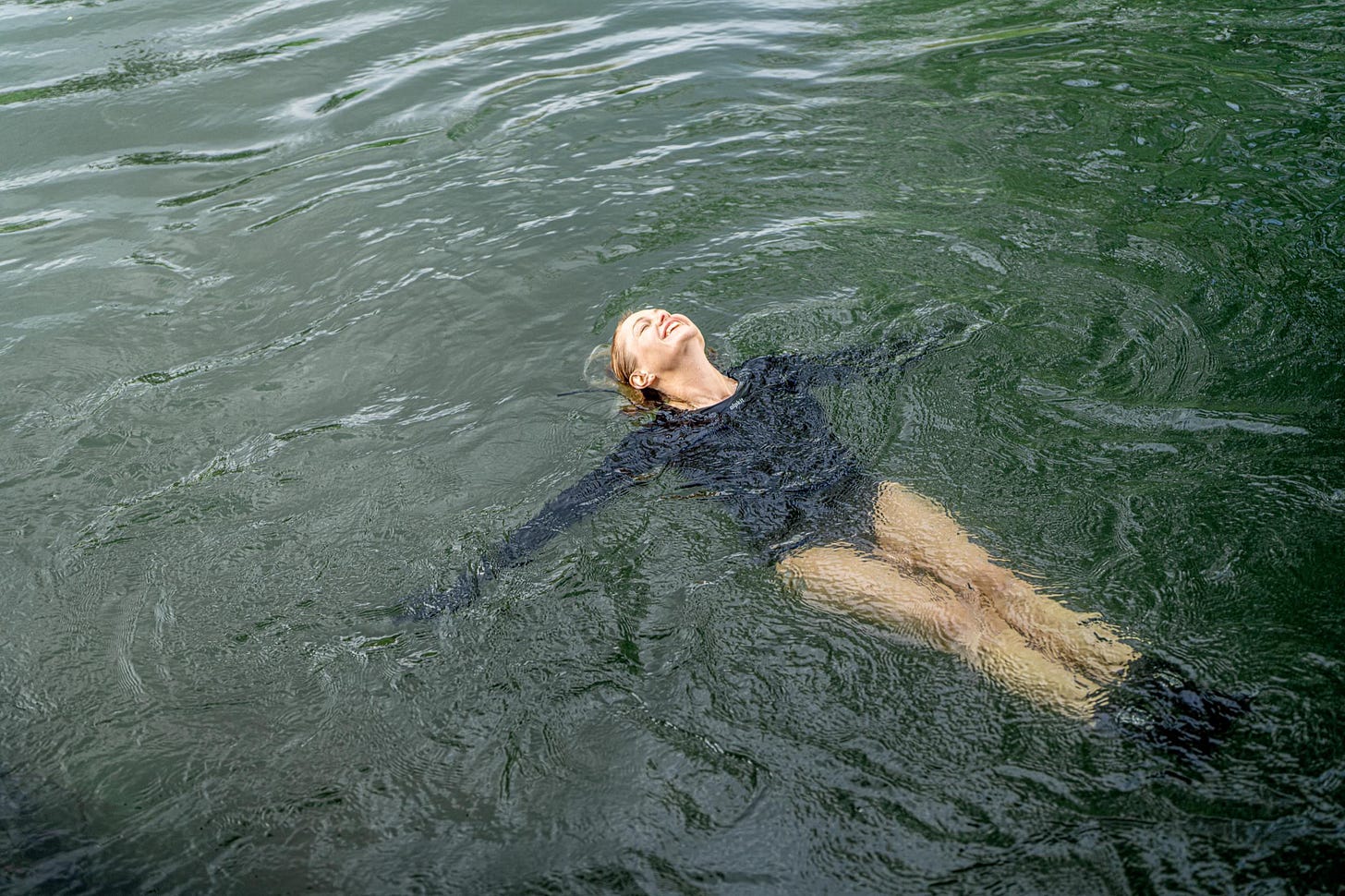 Jane swimming in a river