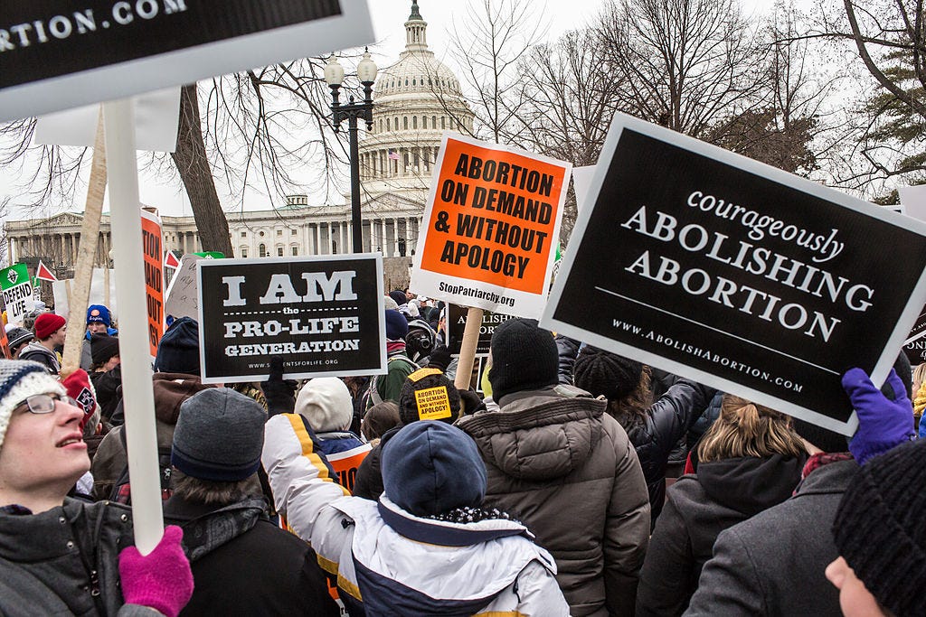 Pro-life and pro-choice activists gather outside the U.S. Capitol.