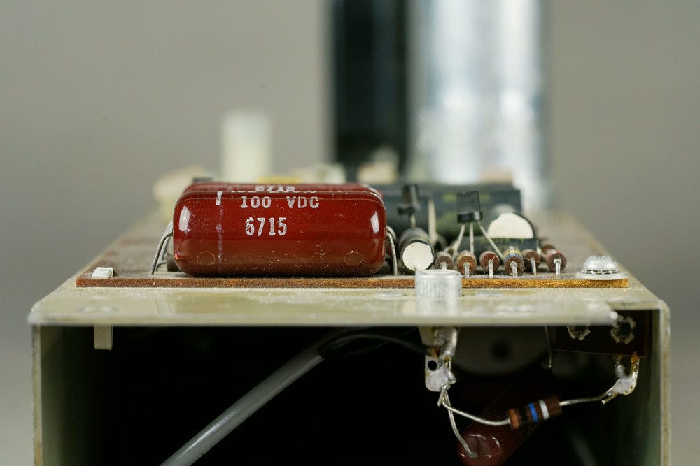 A closeup of the Wurlitzer 140b amp, showing the main piano input jack and the adjacent parts on the circuit board.
