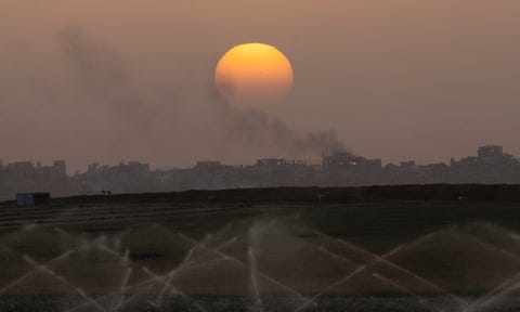 Smoke rises over a ruined building in the Gaza Strip after an Israeli bombardment last week, as seen from a position on the Israeli side of the border