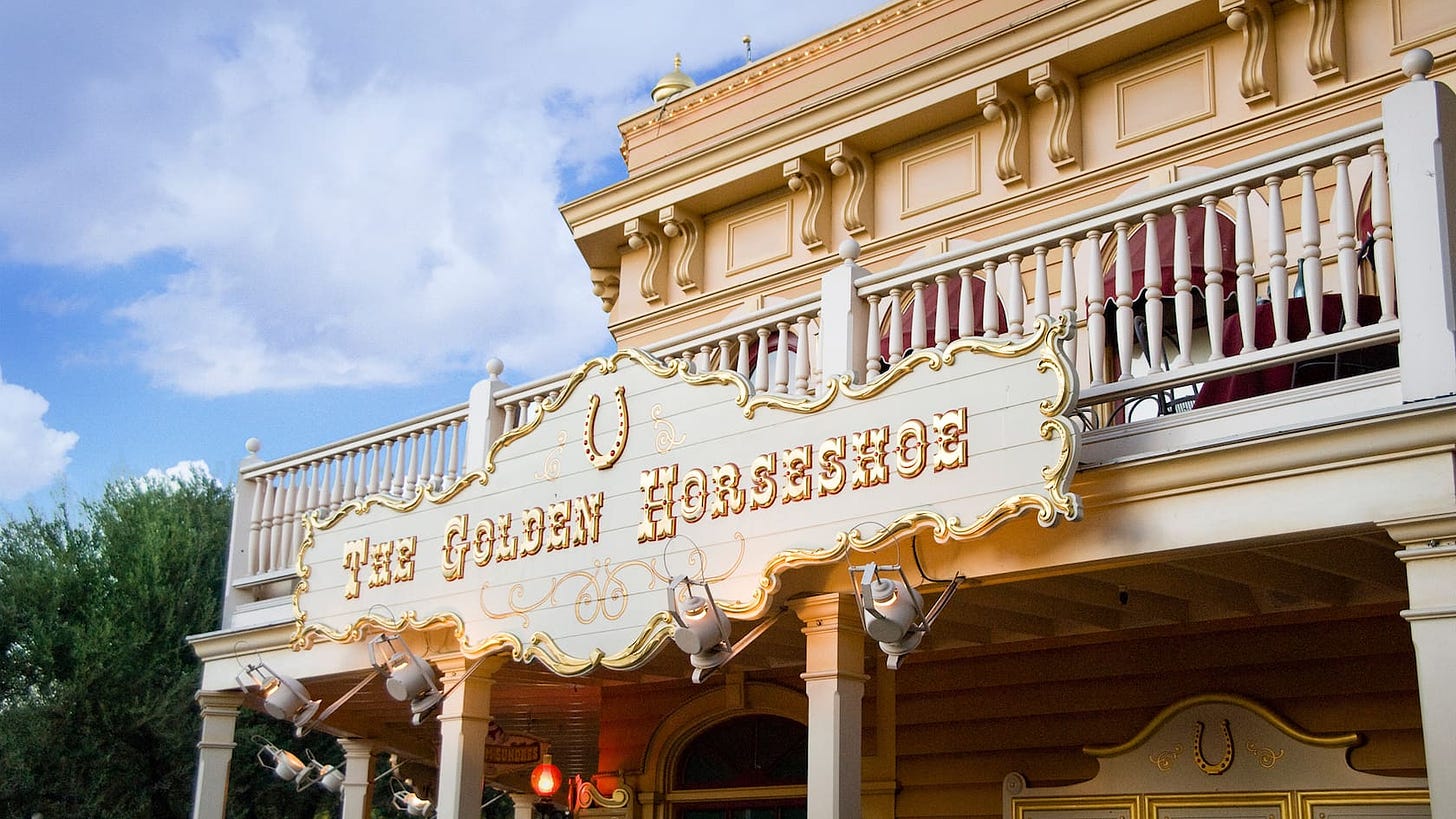 The Golden Horseshoe sign for the theater and dining location in Frontierland