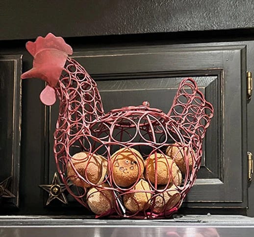 photo of a chicken shaped basket full of dried oranges