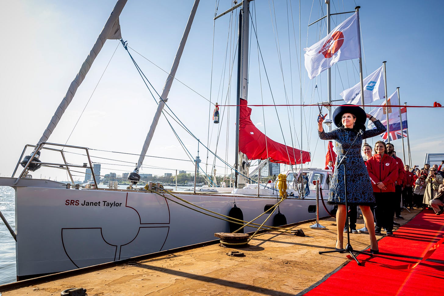 Queen Maxima in front of a boat