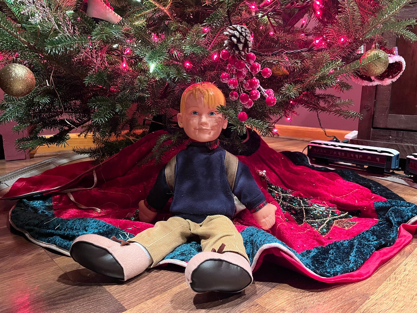 Home Alone Talking Kevin doll underneath the Christmas tree.