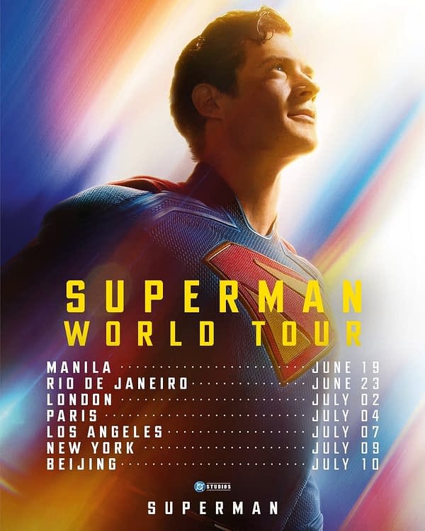 A promotional poster for the Superman World Tour featuring a smiling man in a Superman costume, looking upwards with a vibrant light background. The poster lists tour dates and locations including Manila, Rio de Janeiro, London, Paris, Los Angeles, New York, and Beijing.