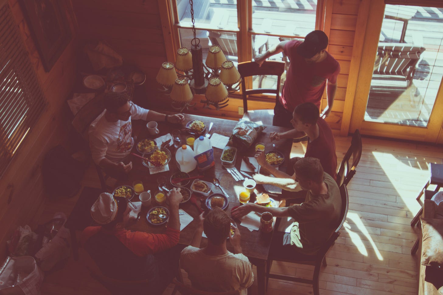 A group of people having a meal together, from above