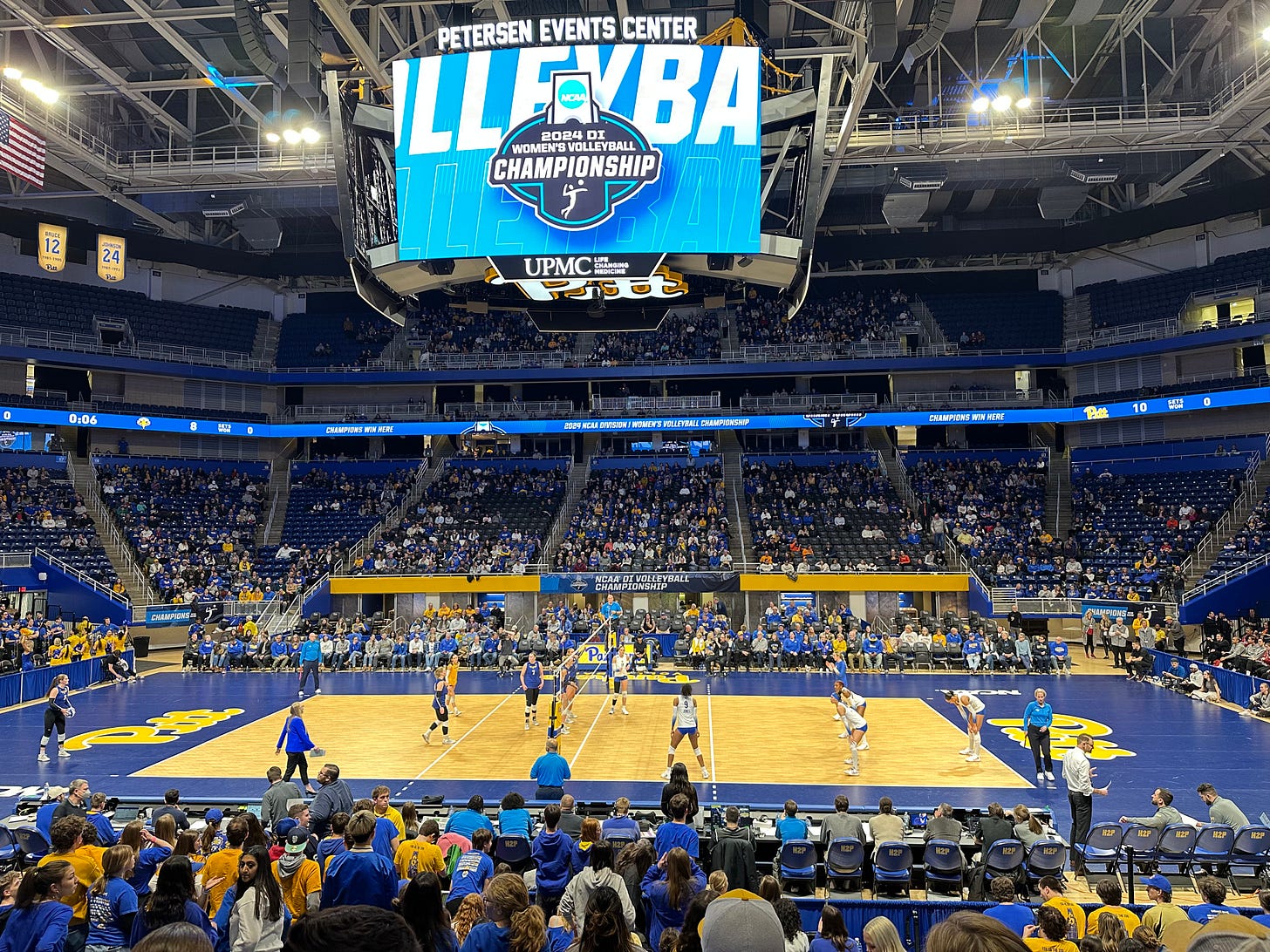 A view of the Petersen Events Center at the start of the NCAA Volleyball Tournament. A little less than half of the visible seats are filled, while players stand on the volleyball court ready to play A view of the Petersen Events Center at the start of the NCAA Volleyball Tournament. A little less than half of the visible seats are filled, while players stand on the volleyball court ready to play