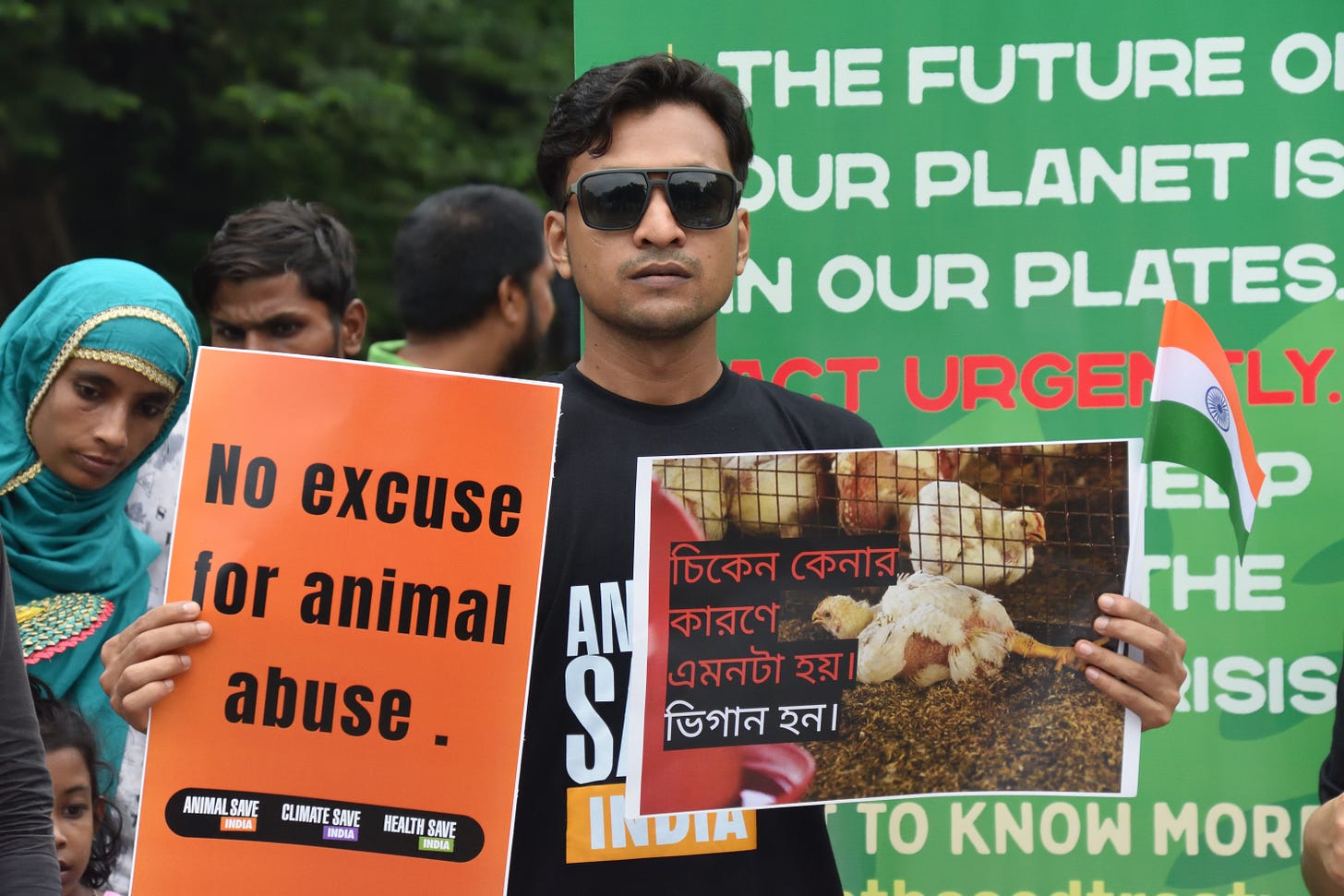 Kolkata, India. Animal lover activists hold a protest demonstration with symbolic human flesh in trays, a poignant visual representation of animals subjected to horrors of factory farming and posters against animal exploitation — Photo by EyepixGroup