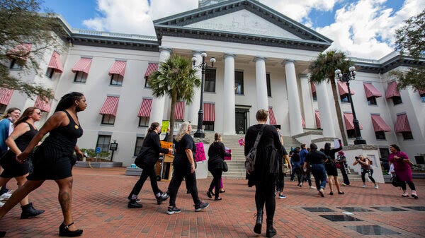 Supporters of abortion access march in front of the Florida Capitol Building in February 2022. 