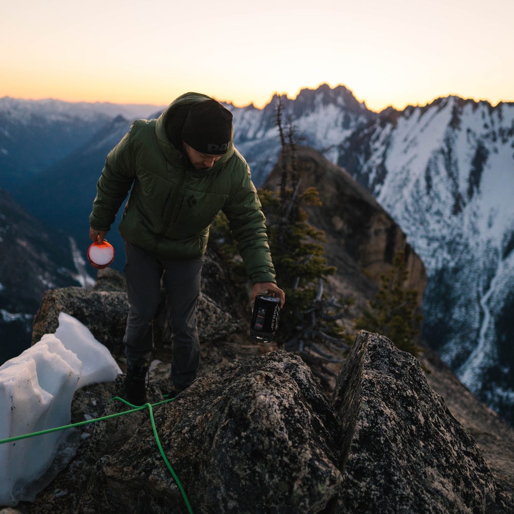 Melting snow for water on a cold bivy in North Cascades National Park. Shot by, Ben Matthews. 