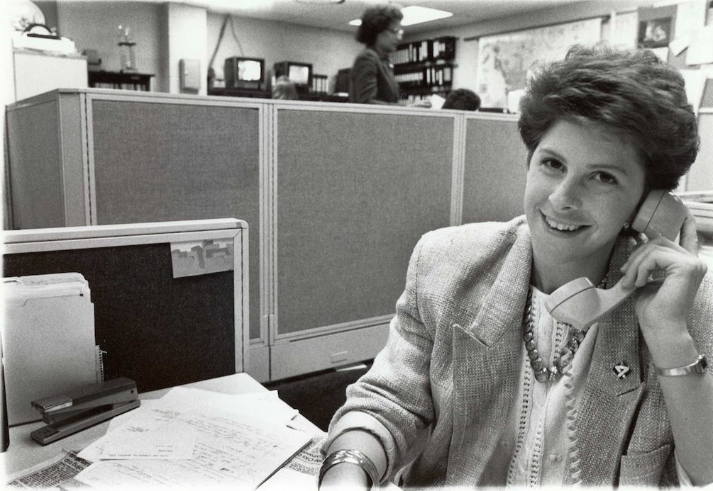 Image of author as a young reporter in KXLY newsroom, with a hair style that Oprah mocks. 