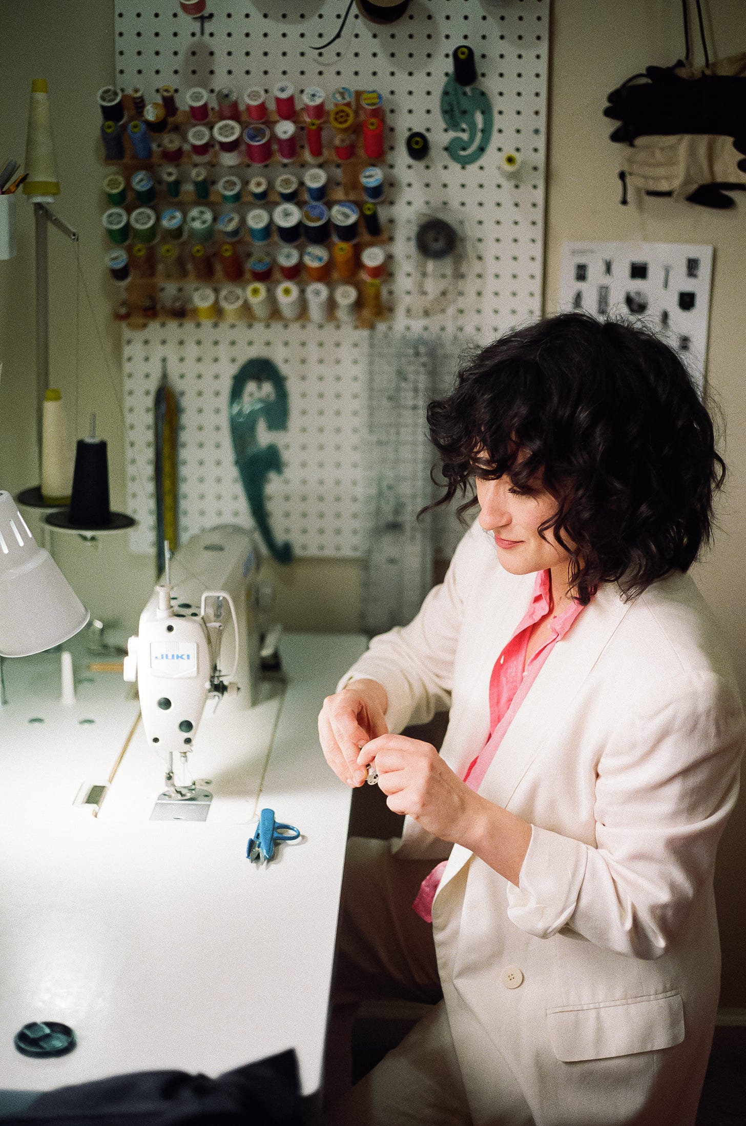 Laurs Kemp threading a sewing machine