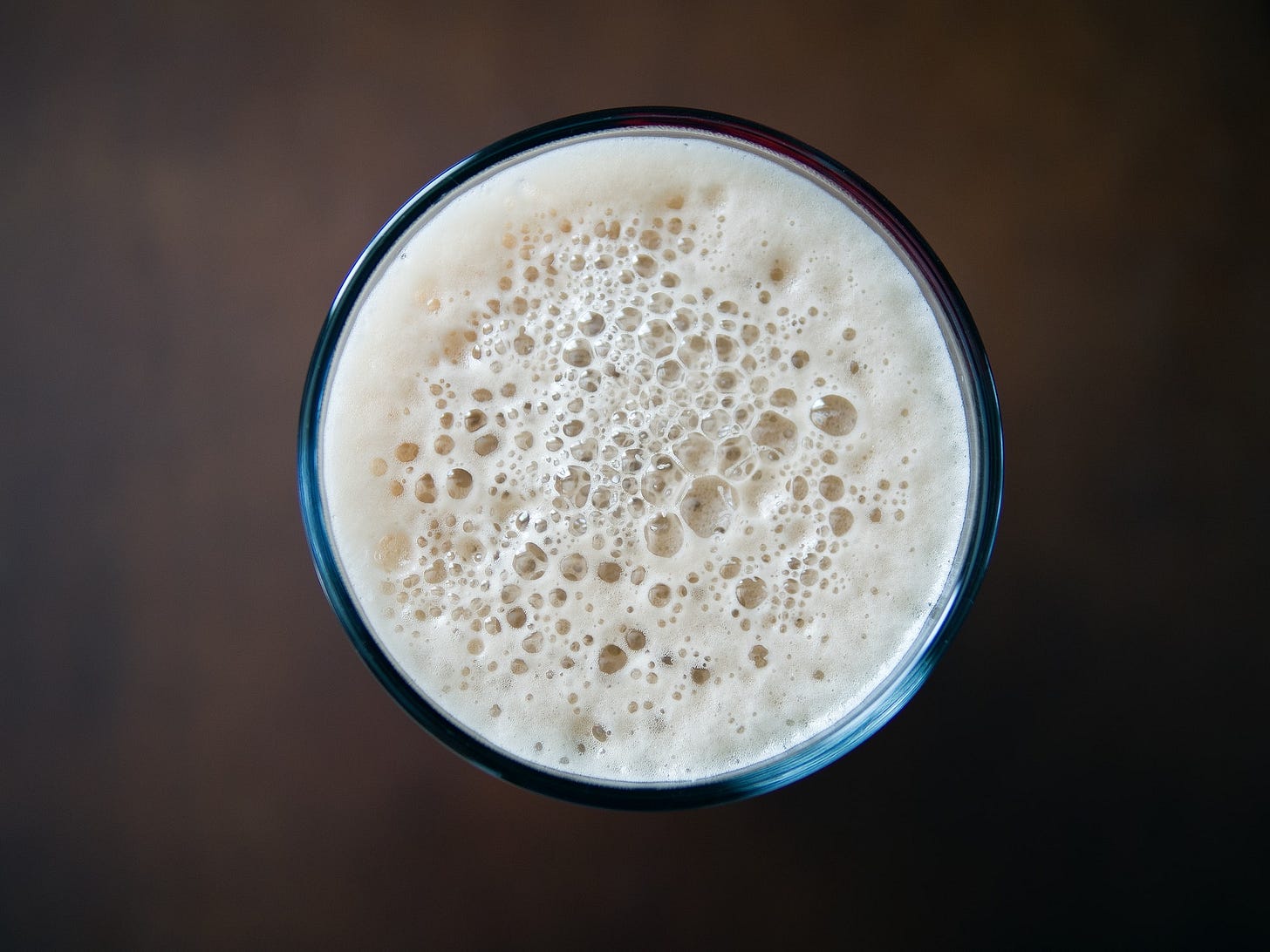 The top of a foamy drink.