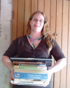 Stack of books and woman