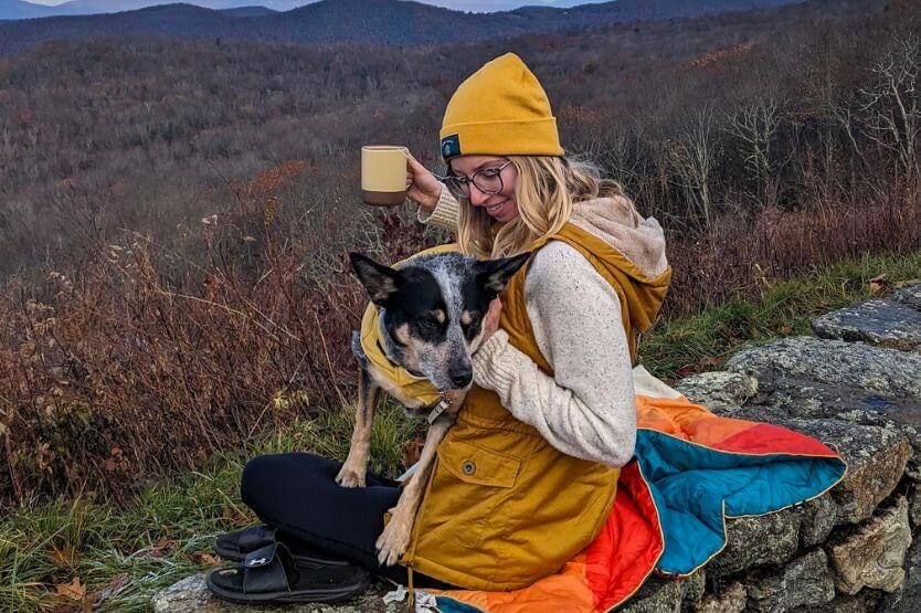 Scout the blue heeler and Haley her human pose at an overlook in Shenandoah National Park