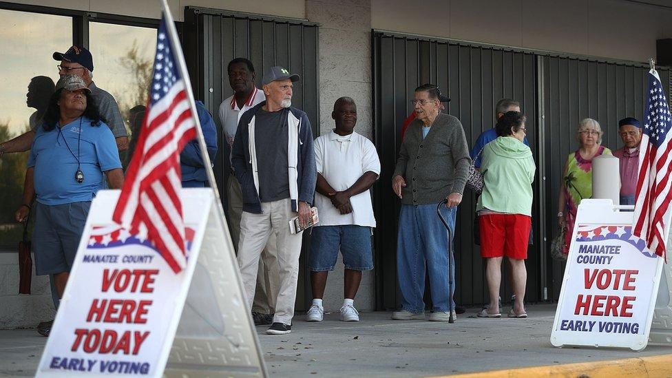 Voters line up to vote early at the Supervisor of Elections office in Bradenton, Florida.