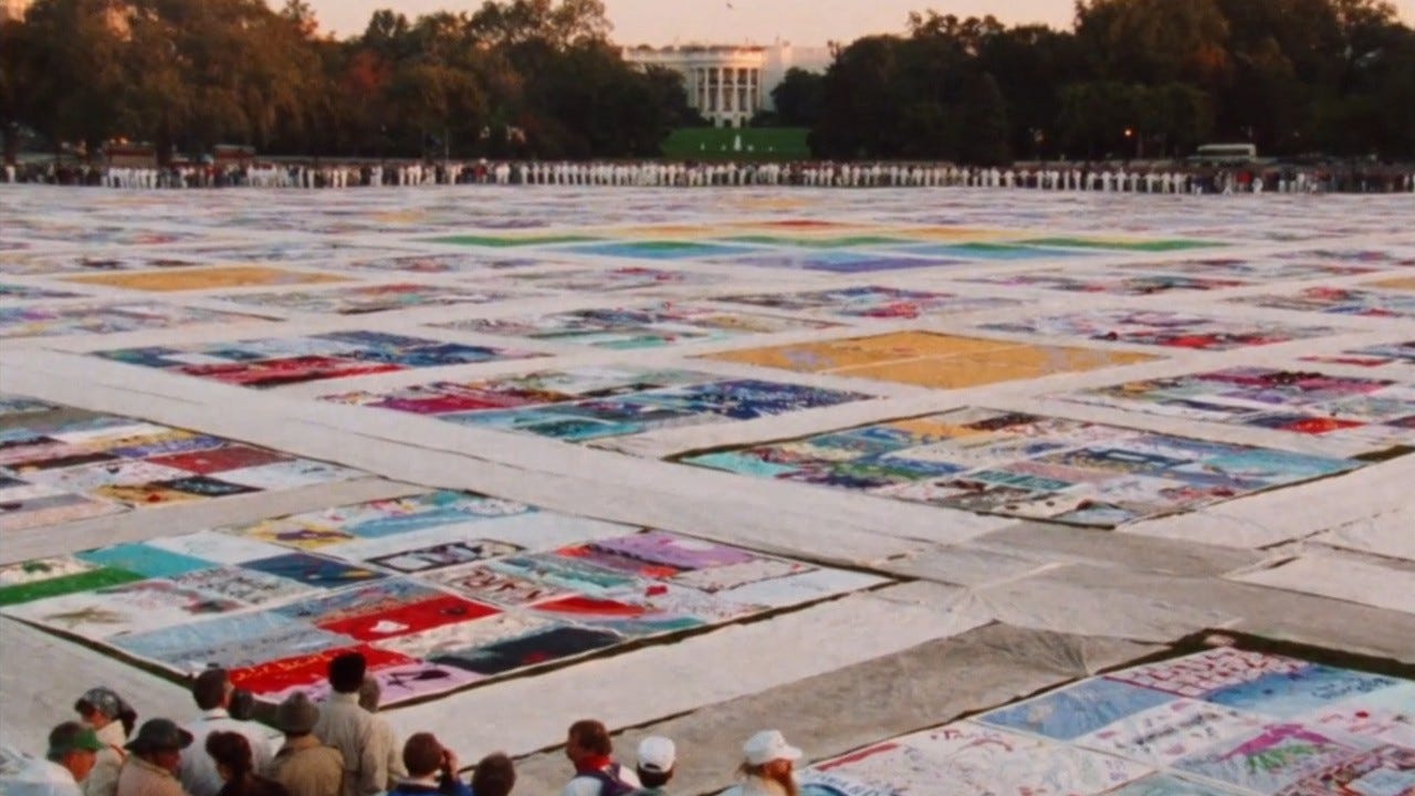 Common Threads: Stories from the Quilt | Still features the titular quilt being laid out across a public space.