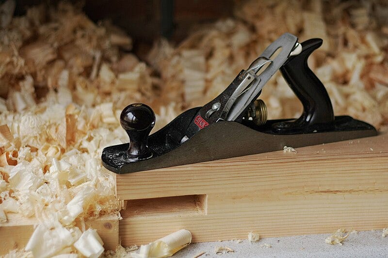 A Stanley Jack plane amongst a pile of shavings. A Stanley Jack plane amongst a pile of shavings.