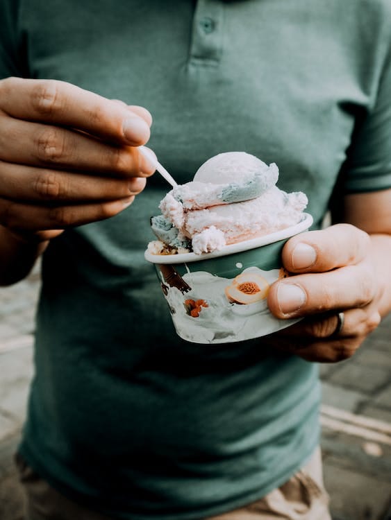 Free Person Holding a Cup of Ice Cream Stock Photo