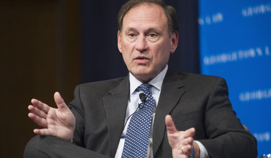 Supreme Court Justice Samuel Alito gestures while speaking at Georgetown University Law Center&#x27;s third annual Dean&#x27;s Lecture to the Graduation Class,  in Washington, Tuesday, Feb. 23, 2016. (AP Photo/Cliff Owen)