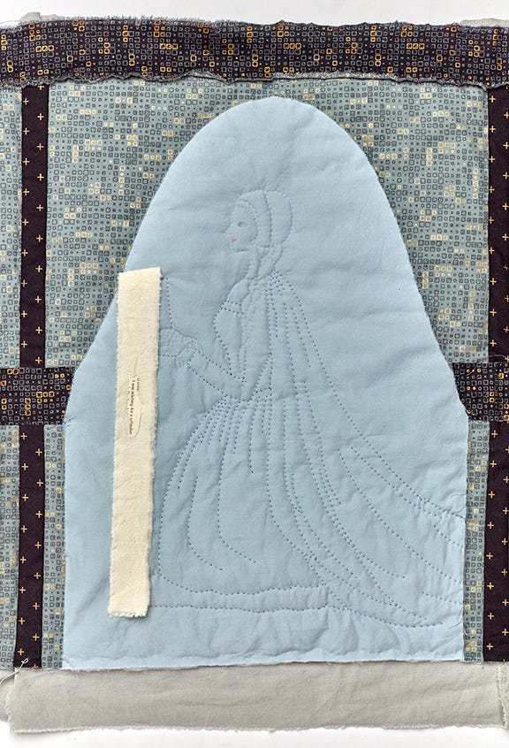 A stitched figure of a kneeling woman dressed in sixteenth century dress, she holds a piece of cloth that holds the words "I was stitching for a sailmaker"