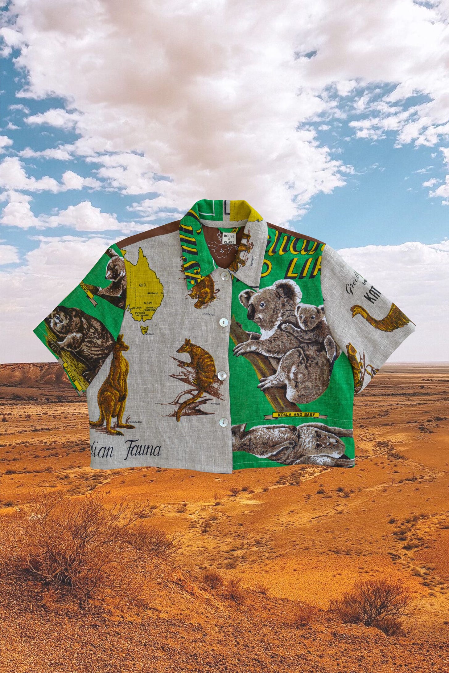 A photo of a Button up shirt made by House Of Clare with the fabric being the theme of Australian animals like a koala and kangaroo