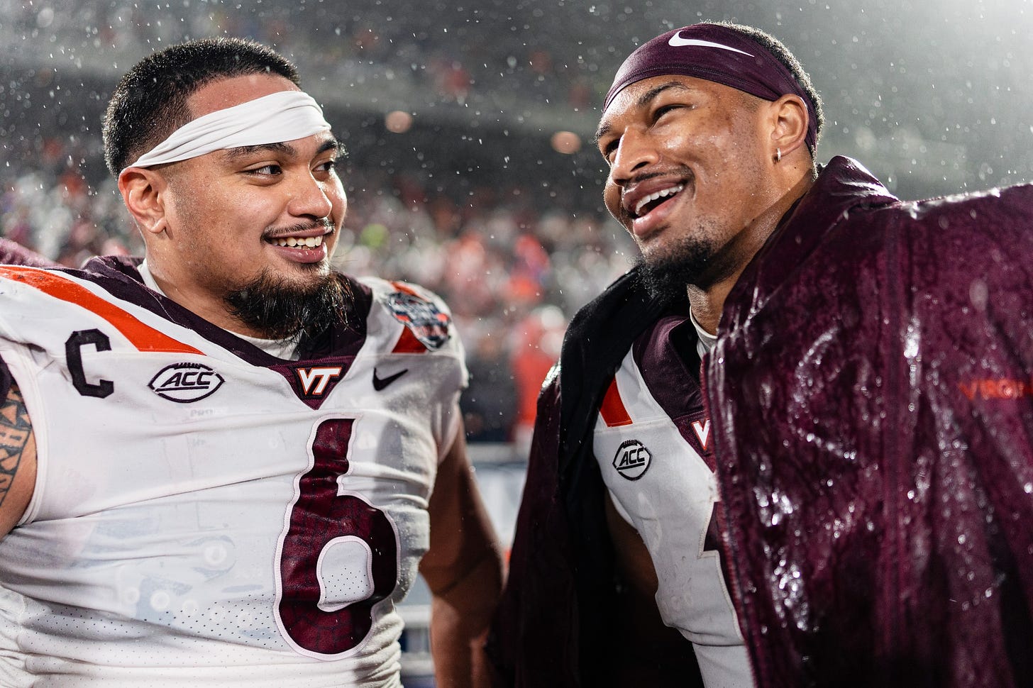 Virginia Tech's Josh Fuga and Kyron Drones embrace one another at the 2023 Military Bowl.