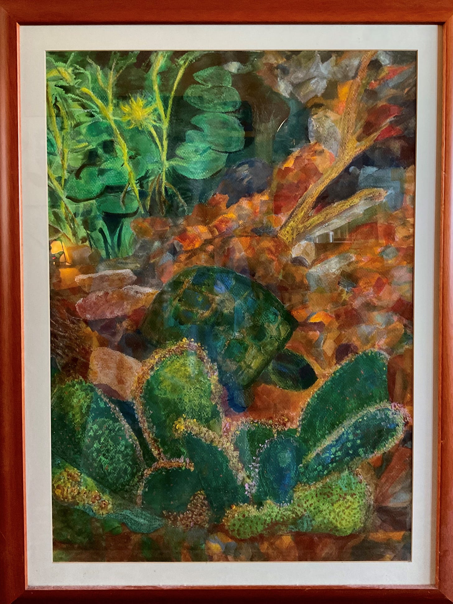 Mixed media painting by Sherry Killam Arts depicting a green shelled tortoise in an earthy habitat of lily pads, cactus plants, colored rocks and twigs.